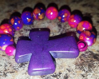 Child's Pink and purple beaded purple cross bracelet