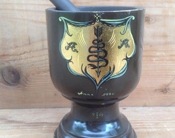 Mortar and pestle made of wood and hand painted