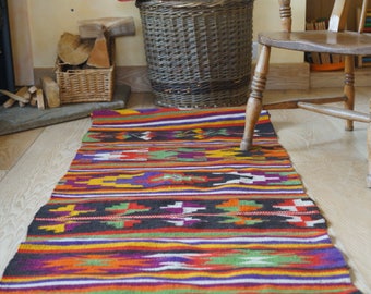 Vintage handwoven hemp runner with geometric design.