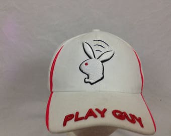 White n red play guy hat
