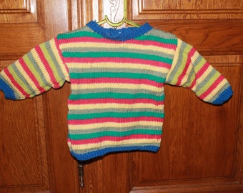 Pullover multicolor striped child's hands