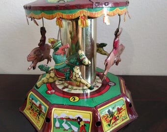Tin toy-vintage CAROUSEL CAROUSEL with horses year ' 70