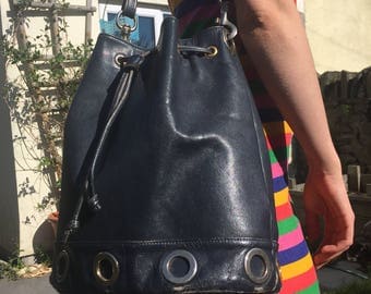 Navy blue leather vintage bucket bag with gold ring detail