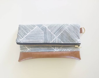 Black and white striped clutch with brown faux leather