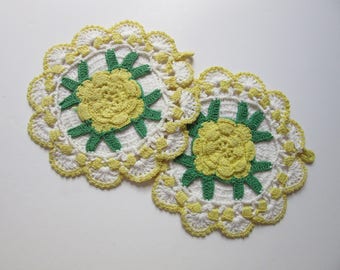 pair of crocheted pot holders / yellow roses