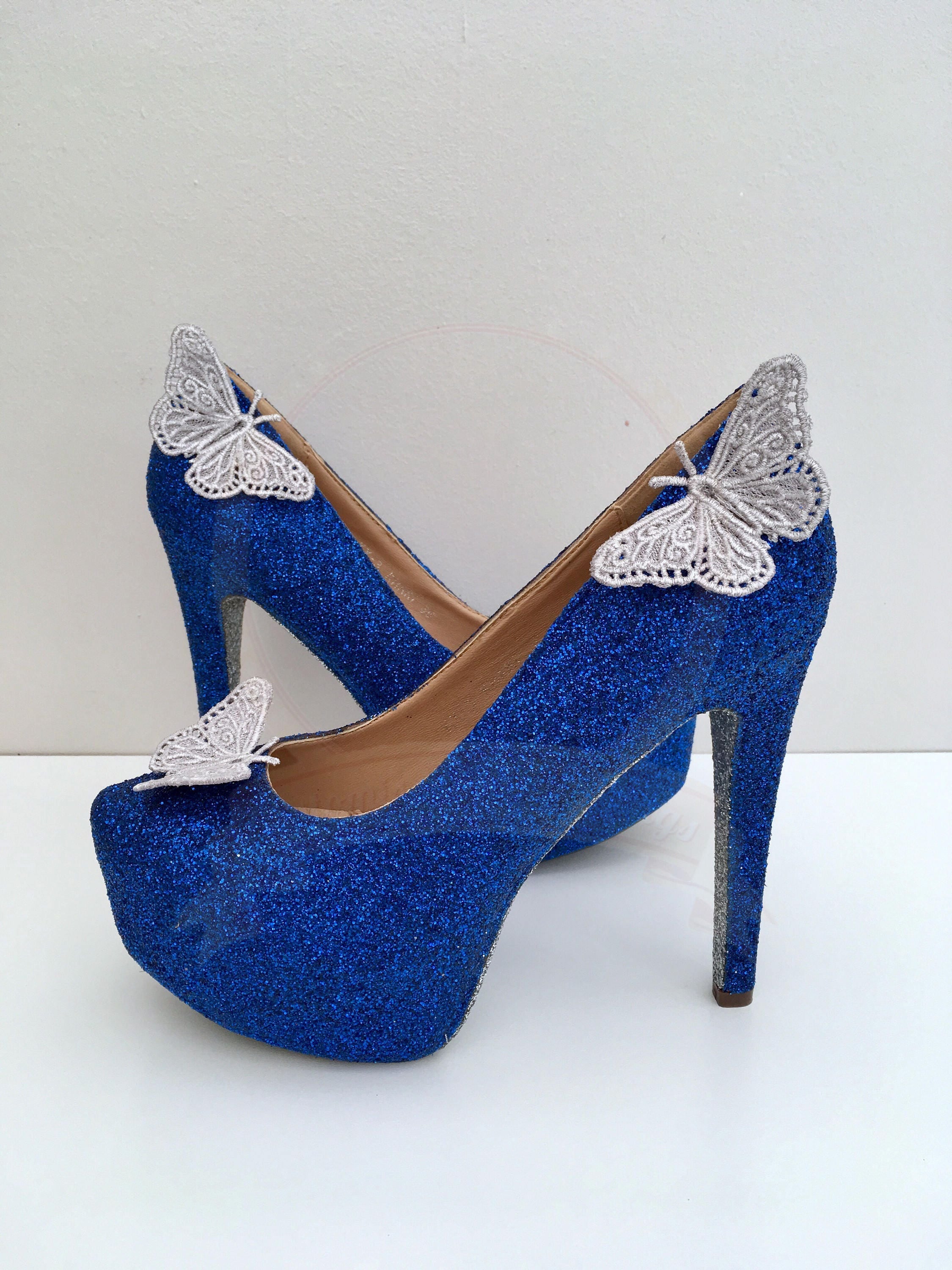 white shoes with blue butterflies