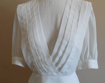 1970s Redux 1940s, Creme Cropped Blouse with Diagonal Rows of Pleats, Wide Waistband and Elbow Length Sleeves by Lloyd Williams