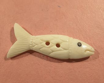 Hand carved bone fish (carved both sides).