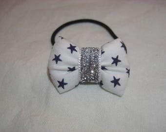 scrunchy with a white fabric with Navy stars bow