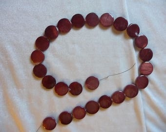 Beads, Mother of Pearl, 15mm Flat Round Coin, Rust Color. Sold per 15 inch strand. There are 25 beads on the strand.
