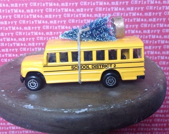 School Bus Carrying Christmas Tree, School Bus Christmas ornament, Maisto Car Christmas Tree Ornament