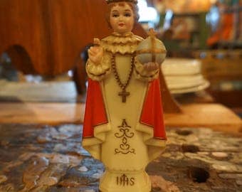 plastic child of prague statue