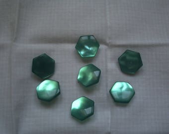 7 emerald green button with a hexagonal shape