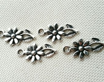 Set of 4 adorable Tibetan silver charms