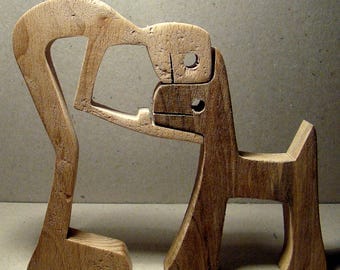 Carving wood scalloped "one man dog"