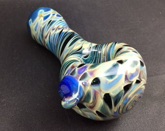 Glass smoking pipe, hand blown, wrap and rake tobacco pipe. Teal glass with blue and amber purple plus silver fumes.