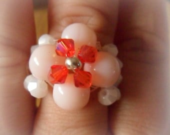 Pink, red and white woven flower ring