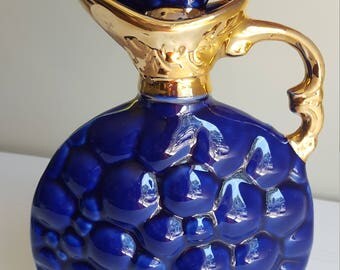 Jim Beam 1963 decanter in grape pattern.