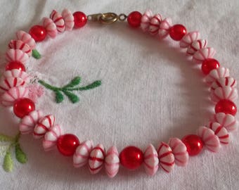 Bracelet red beads and flower beads