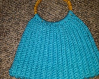 Crocheted turquoise lined purse with bamboo handles