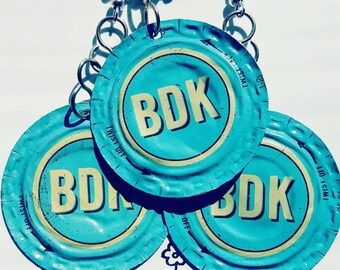 Upcycled Brew Dr. Kombucha bottle-cap set of earrings and necklace.