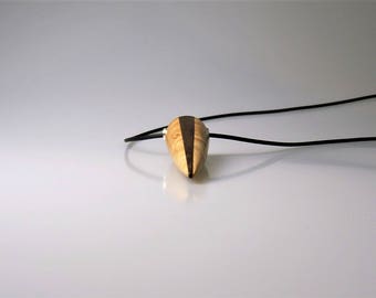 Amulet made of ash wood with ebony inlay