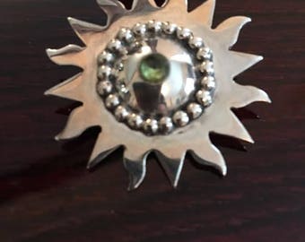 Silver sunflower pin with gemstone