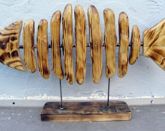 Large wooden fish in pine flamed