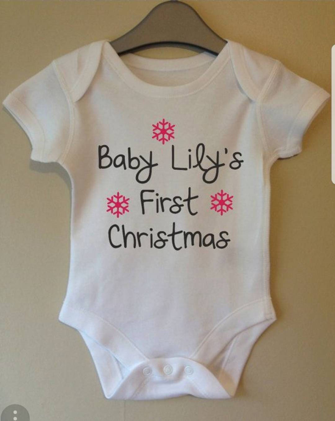 Personalised baby's first christmas baby vest.