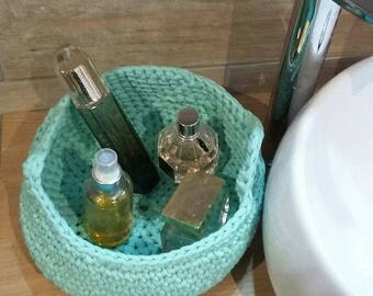 Green color storage basket with water