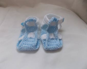 the small blue and white sandals