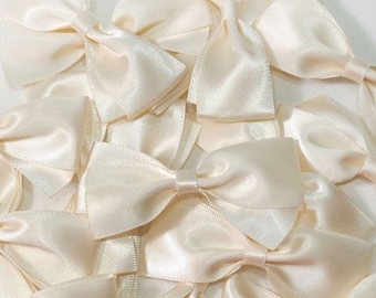 Ivory satin scrapbooking lot of 10 knots