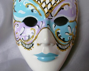 blue white Venetian style mask plaster purple and sky