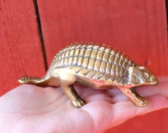 brass dinosaur figurine