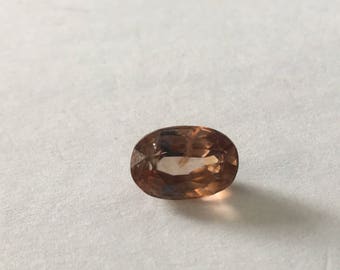 Champagne sapphire oval weight 4.78 carats size 11x7.5 mm
