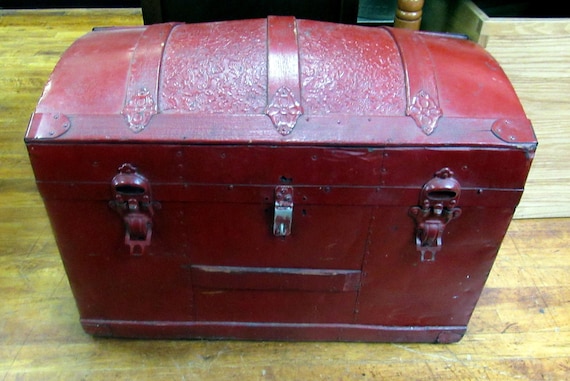 Antique humpback trunk painted red