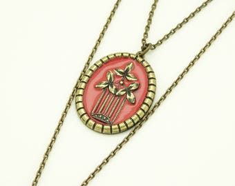 Necklace with plum enamel and ornate frame