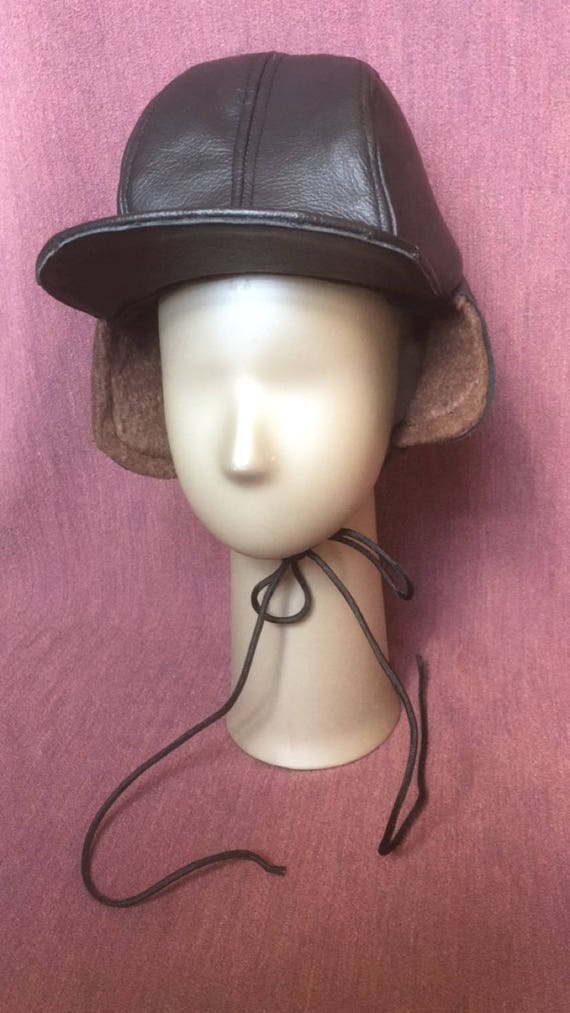 Black leather brown faux fur winter hat