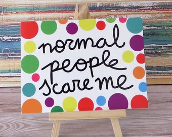 Colourful polka dotted " Normal people scare me" illustrated positive postcard by Tisetas&Co.