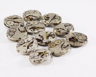 Wrist watch metal steampunk repair tools vintage brass clock pieces industrial crafting Altered Art Found object watch crowns embellishment