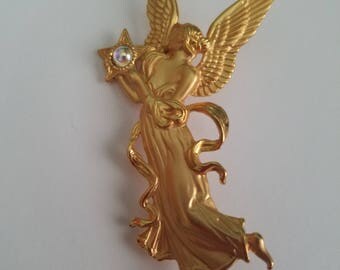 Vintage @jj gold toned angel brooch holding a aurora borealis stone.
