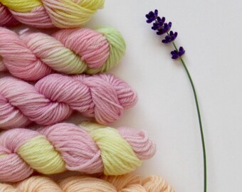 Set of five 10g mini skeins in pinks and yellows merino wool and nylon blend knitting yarn