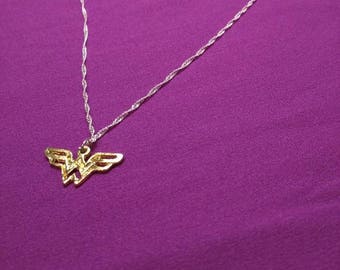 Wonder woman necklace with 18inch silver chain.