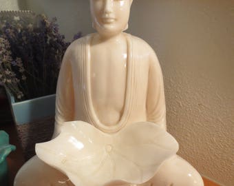 large plastic buddha statue