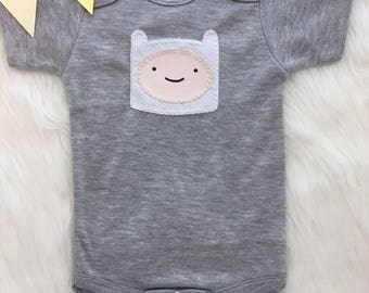 Baby bodysuit with hand sewn Finn from Adventure Time applique, adventure time inspired baby outfit- personalize with your baby's name!