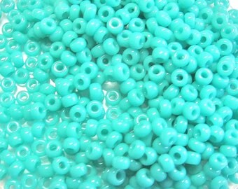 5 OZ OF 1 MM ROUND BRIGHT TURQUOISE BEADS IN BULK