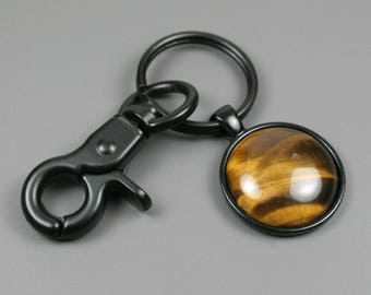 Tiger eye stone keychain in a black bezel setting and swivel lobster claw