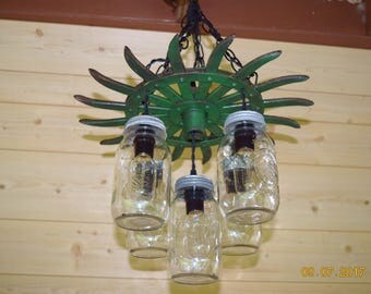 Farmhouse mason jar chandelier made from a John Deere cultivator disc