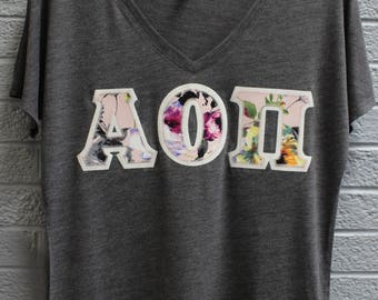 Alpha Omega Pi Charcoal Bella Flowy V-Neck With Floral Fabric on Glitter White (75d)