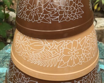Set of three Pyrex bowls mixing bowls serving bowls 2 brown and 1 tan each with white flowers Woodland pattern 1978-1983